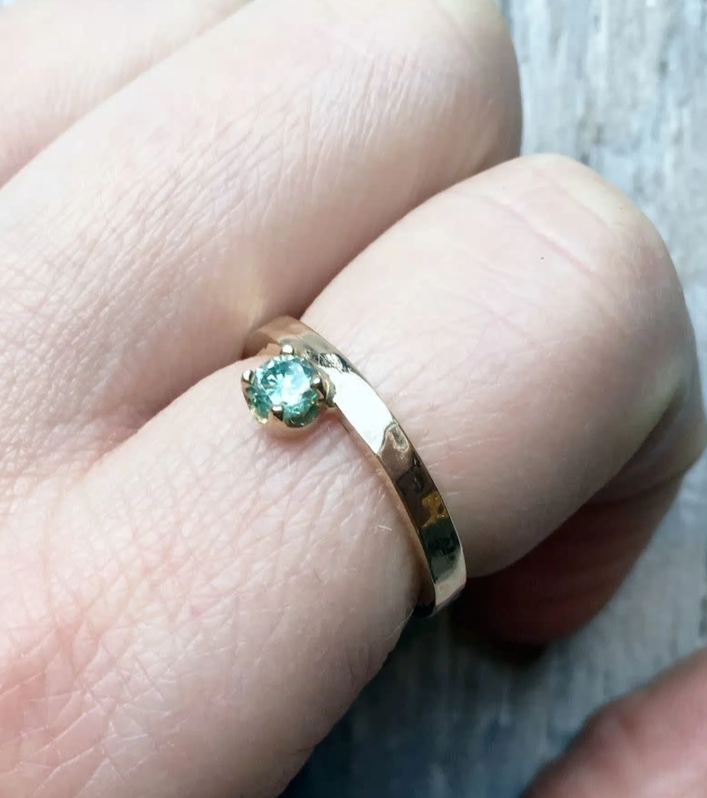 Regal Ring. 4mm Moissenite in 14K yellow gold offset from band. Size 6