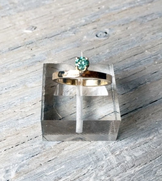 Regal Ring. 4mm Moissenite in 14K yellow gold offset from band. Size 6